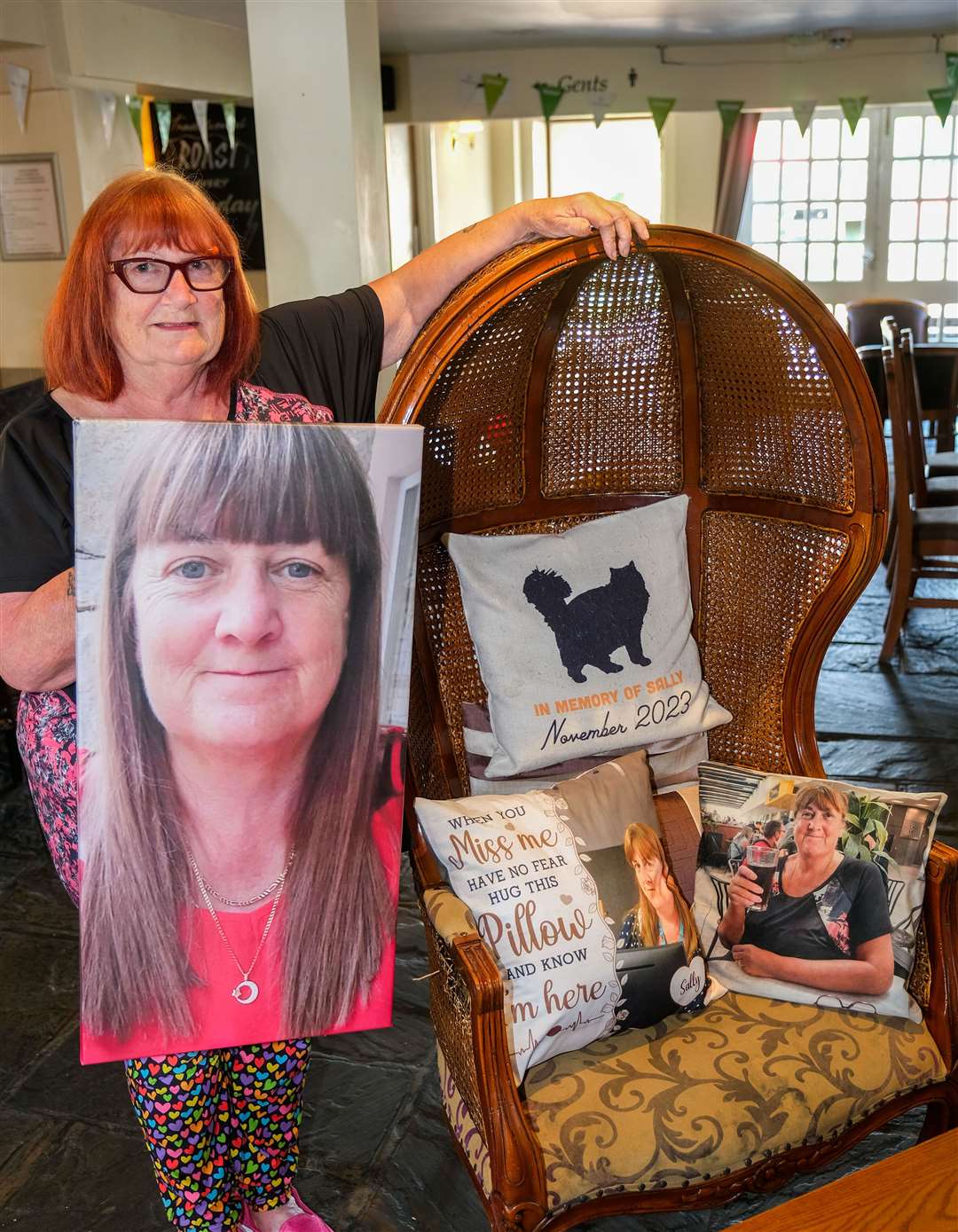A cushion with Sally printed on it sits at The Sawn Pub at Compton - a pub which has been supporting her since her loss