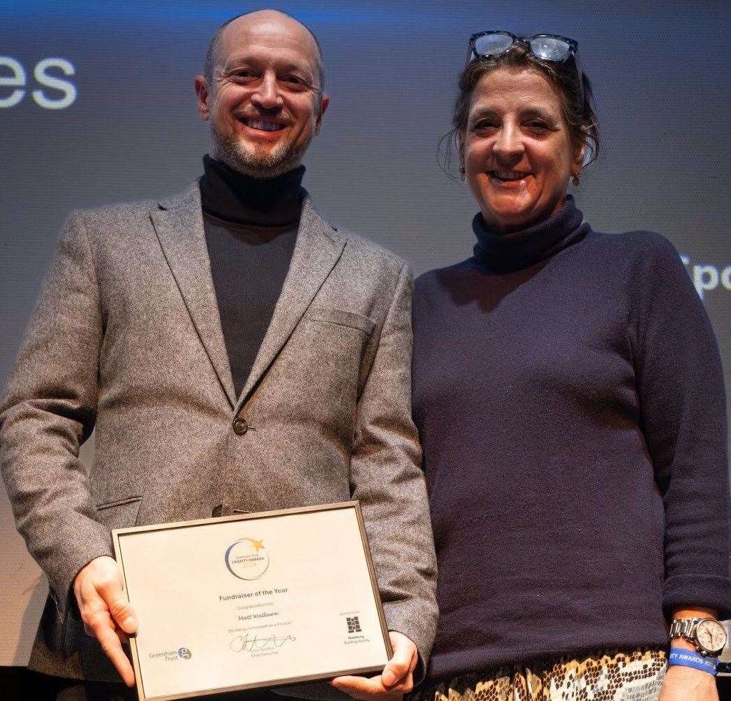 Matt Walburn received an award for supporting Swings & Smiles
