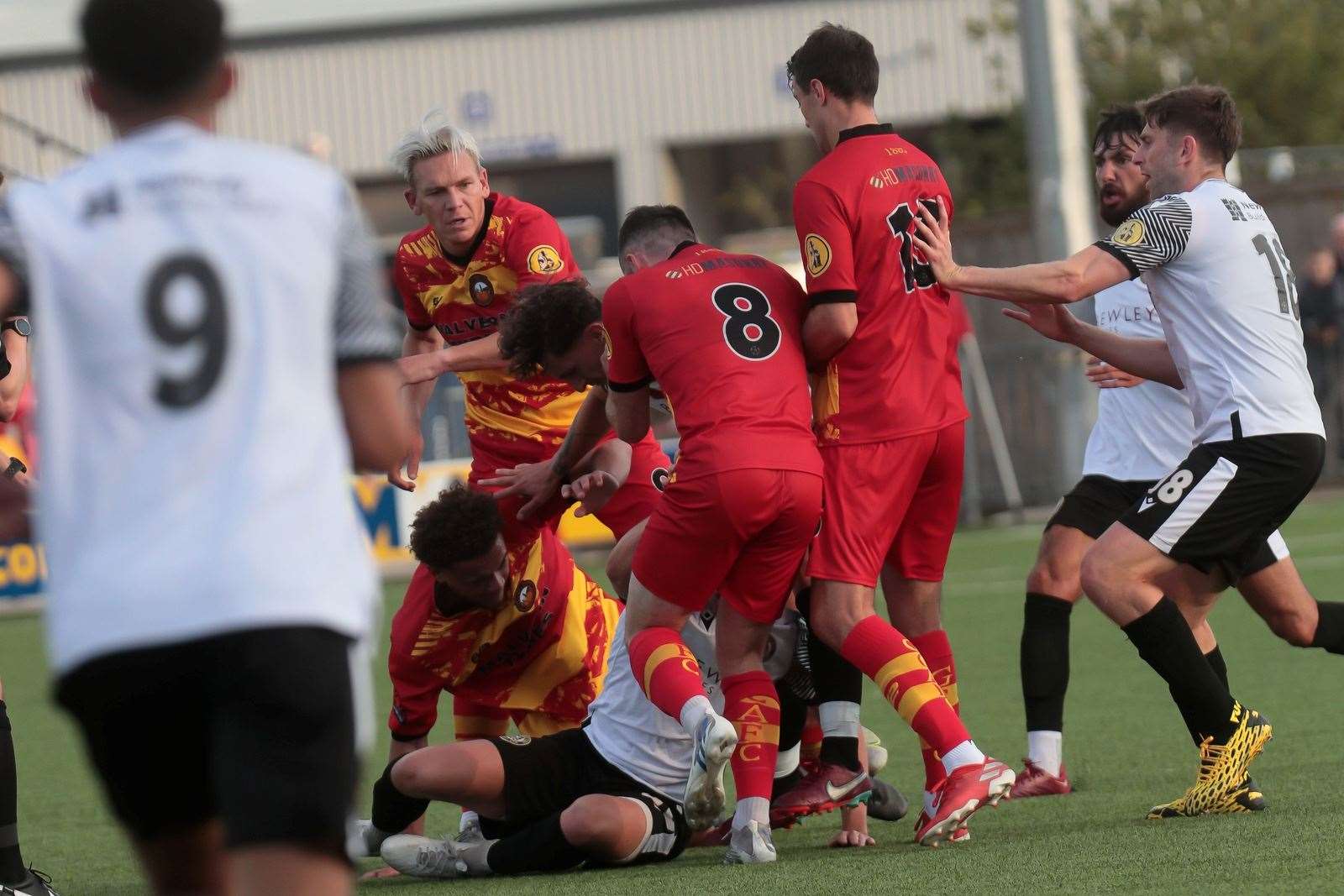 Nathan Davis receives some close attention following a late challenge