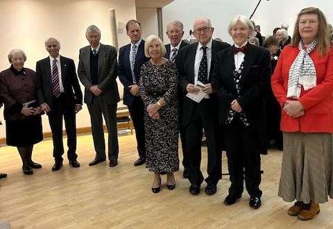 Choir singers inside The Falkland Islands Memorial Chapel at Pangbourne College. Organiser Christina Hill-Williams, right