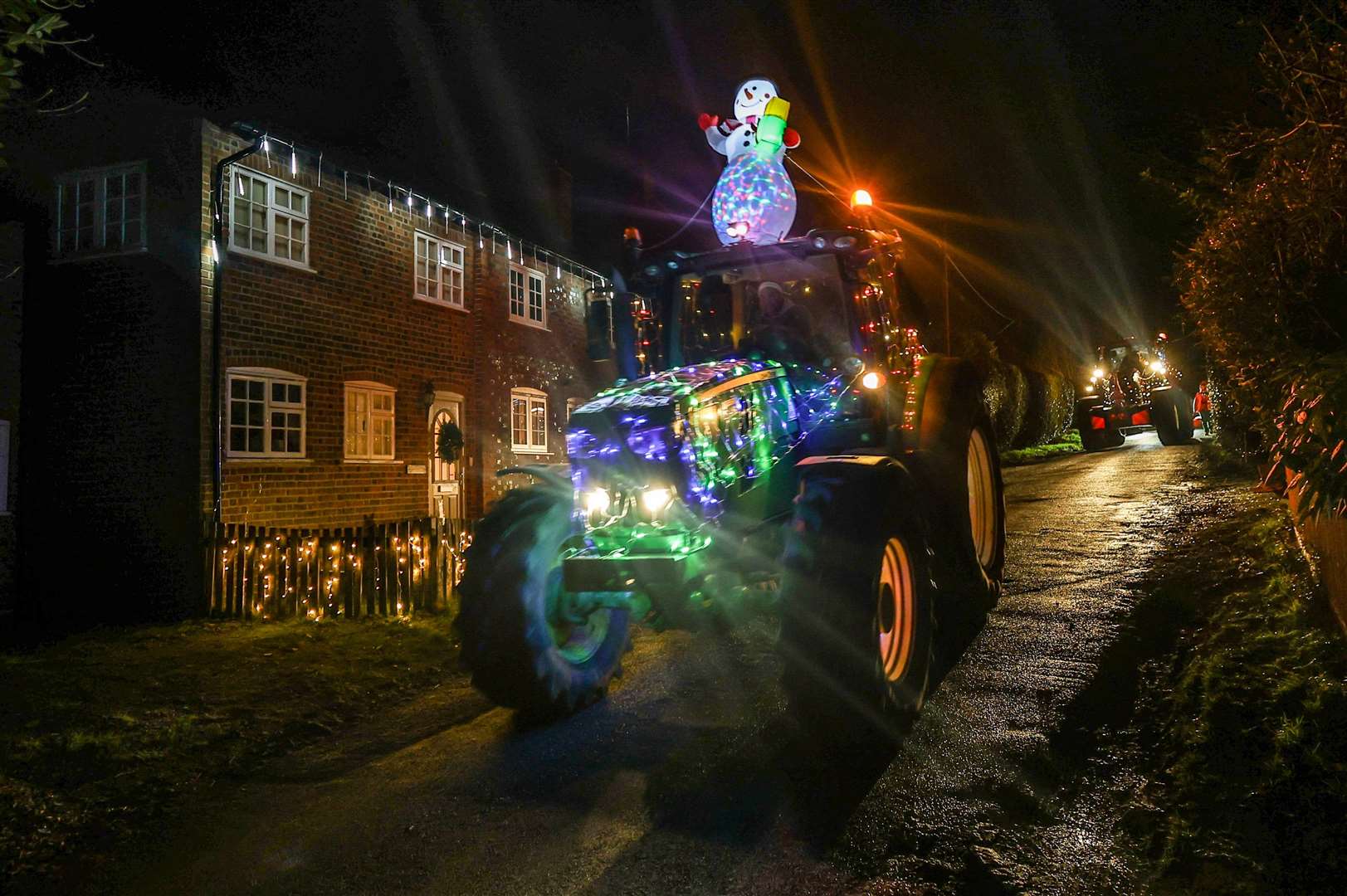 Woolton Hill Christmas Tractor Run coming along Tubbs Lane in Highclere