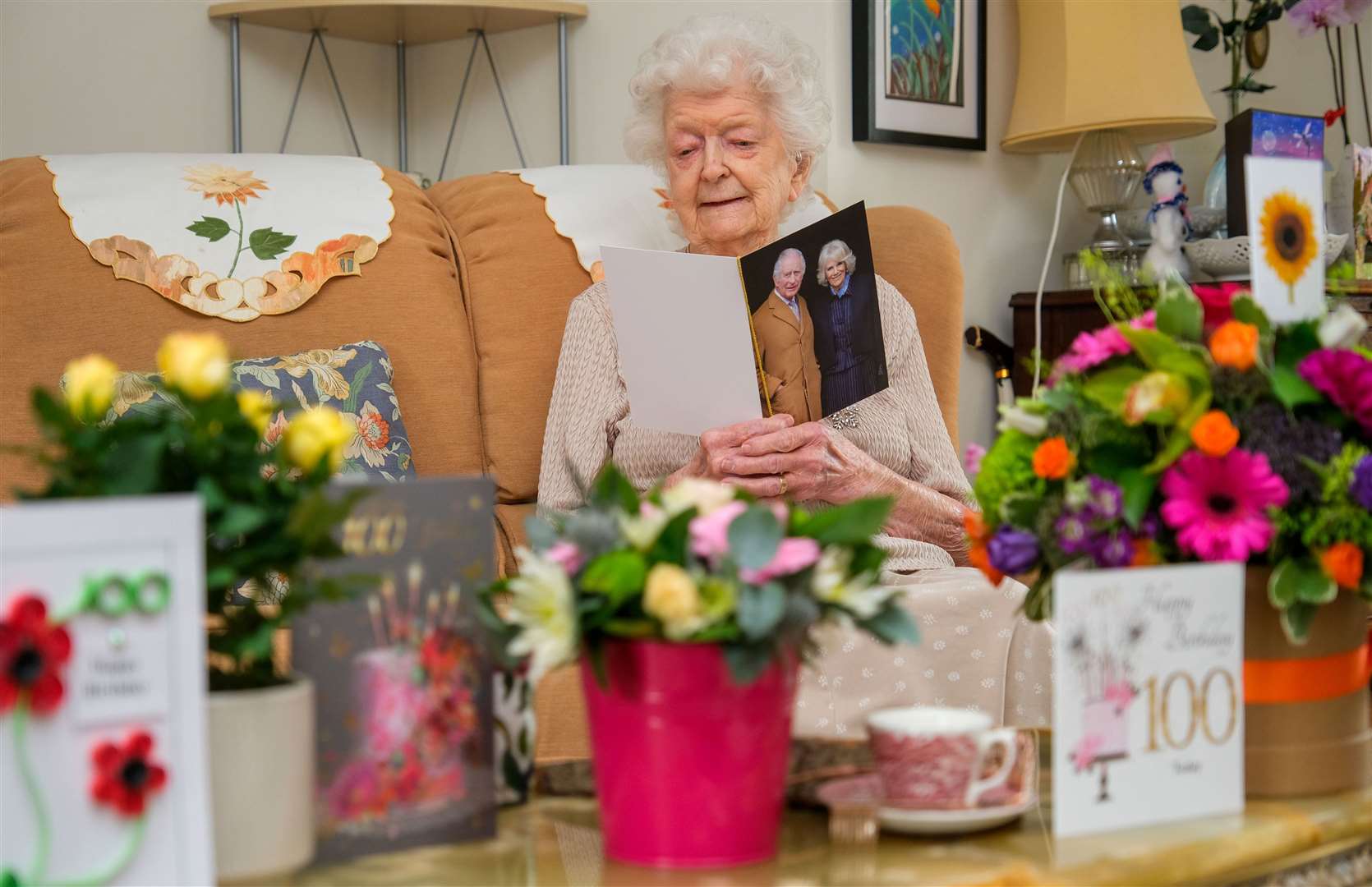Mary Cholwill reading through her growing collection of birthday cards