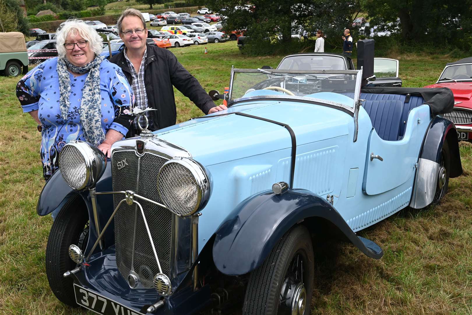 Margo and John Payne with a 1935 Morris 10/6 Sports Special.