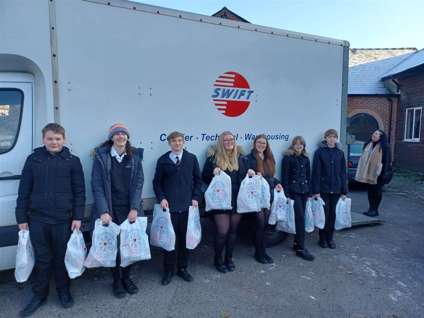 Trinity School pupils about to distribute parcels