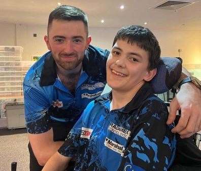 World darts champion Luke Humphries, originally from Newbury, with Jake Parsons