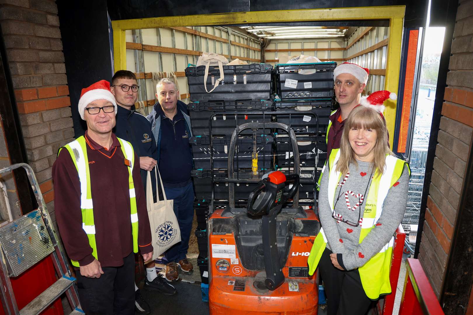 Sainsbury’s hand over the Over 80s’ parcels: Martin Taylor, Carol Irwin and Mark Hamlin with Camp Hopson’s Dan Berridge and Mark Evans