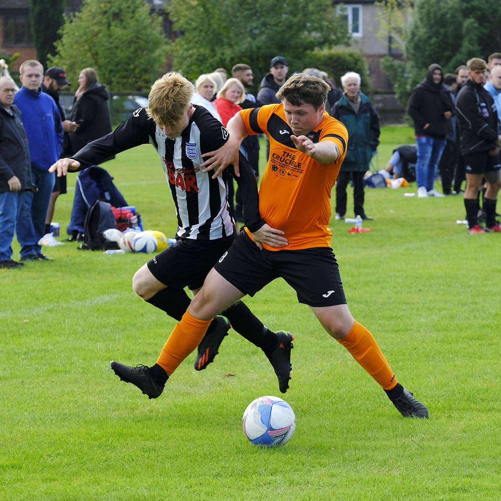 George Armstrong battles with the Diamond defender