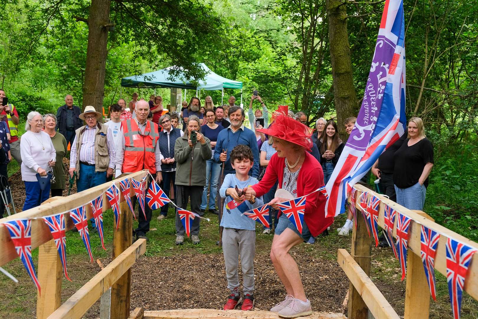 Pat Owen opens the new bridge with help from Felix Roe