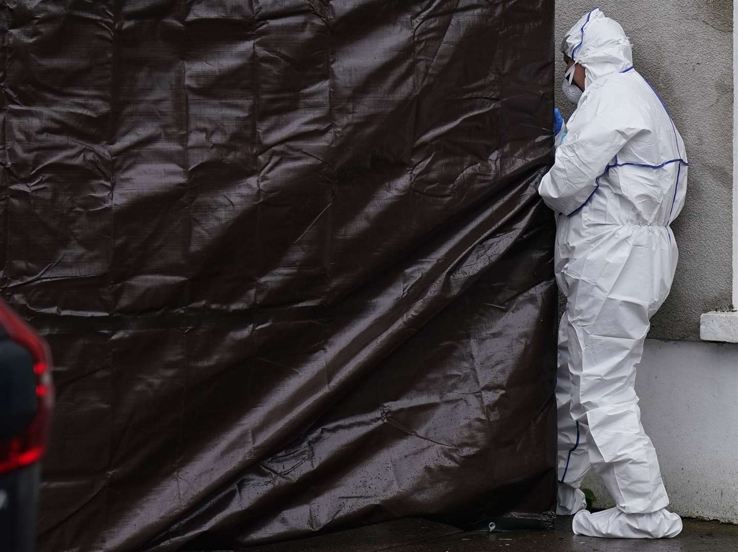 Gardai at the property in Youghal (Niall Carson/PA)