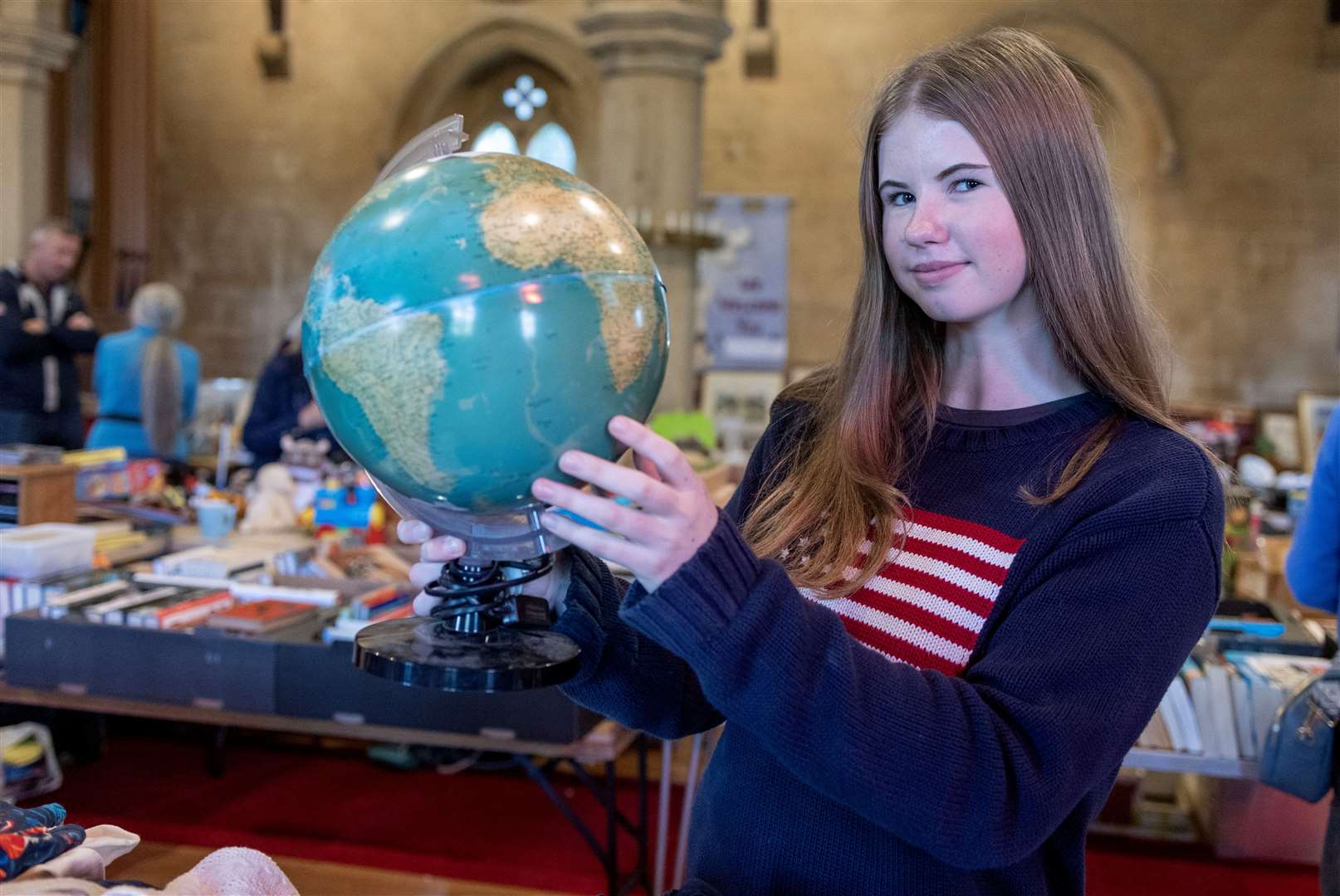 Jess Taylor running one of the many Bric a Brac stalls at St Paul’s Church, Ashford Hill. Credit: David Hartley
