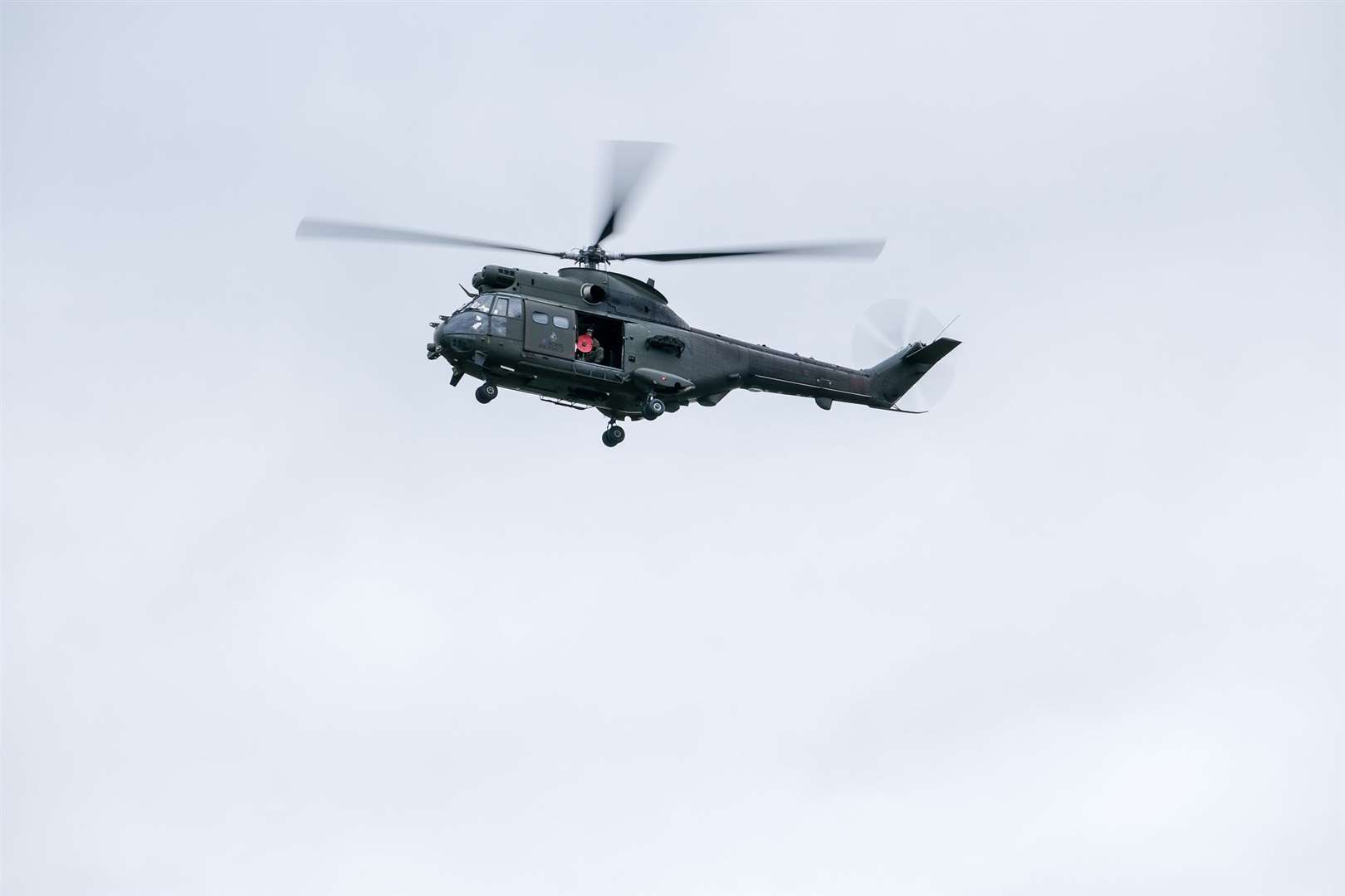 The giant poppy arrives by Puma helicopter to launch this year's local appeal. Ref: 45-0221