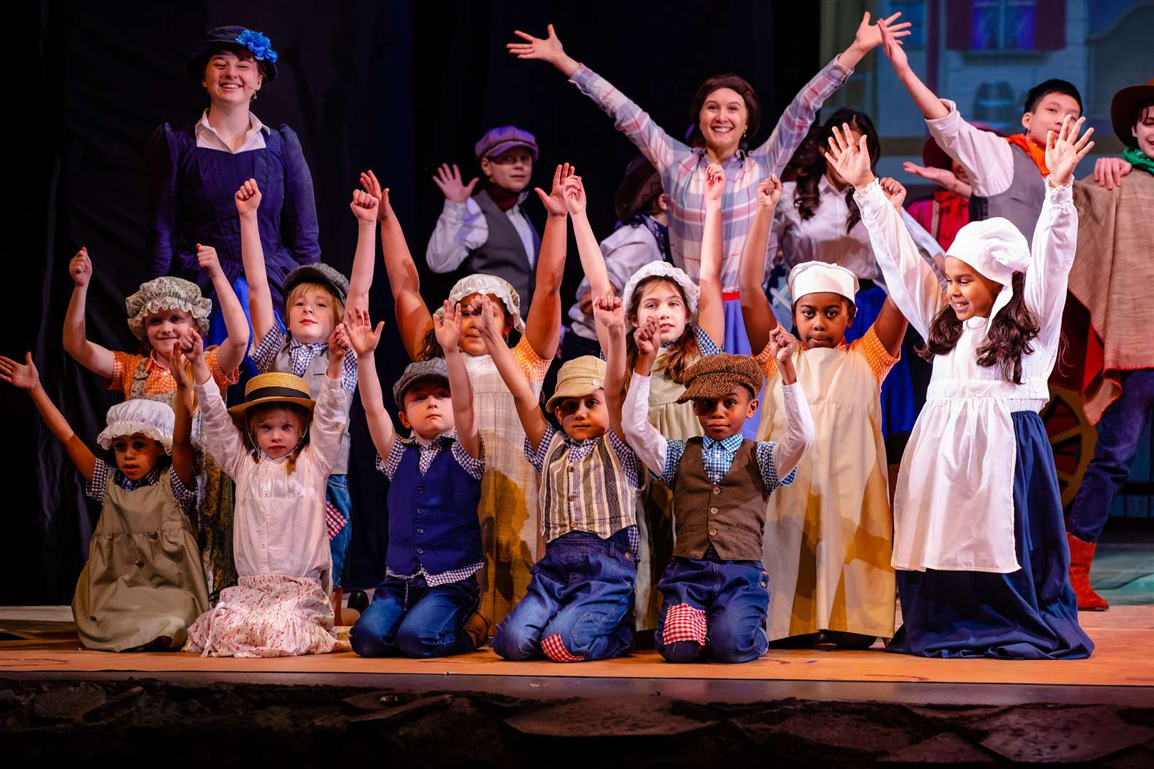 PQA Reading Green students (6-9 years old) performing on a West End stage. Credit: Danny Kaan