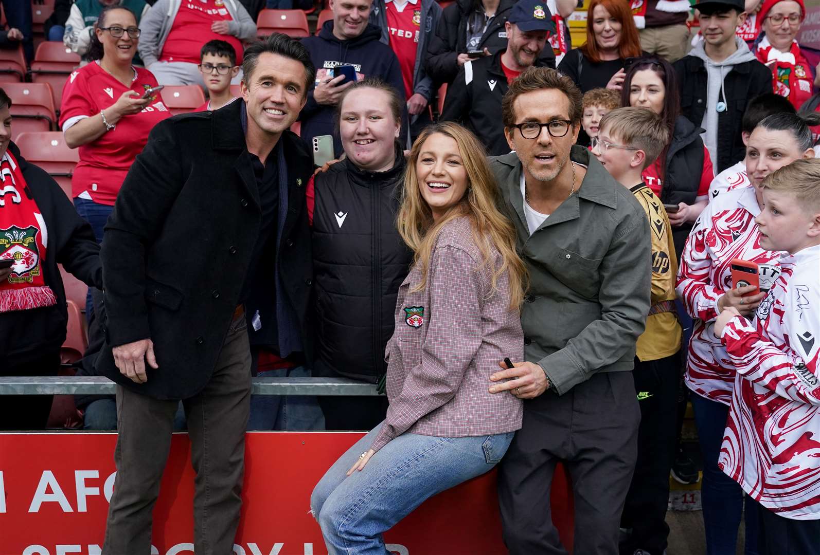 Wrexham co-owners Rob McElhenney (left) and Ryan Reynolds (right) and his wife, Blake Lively (Martin Rickett/PA)