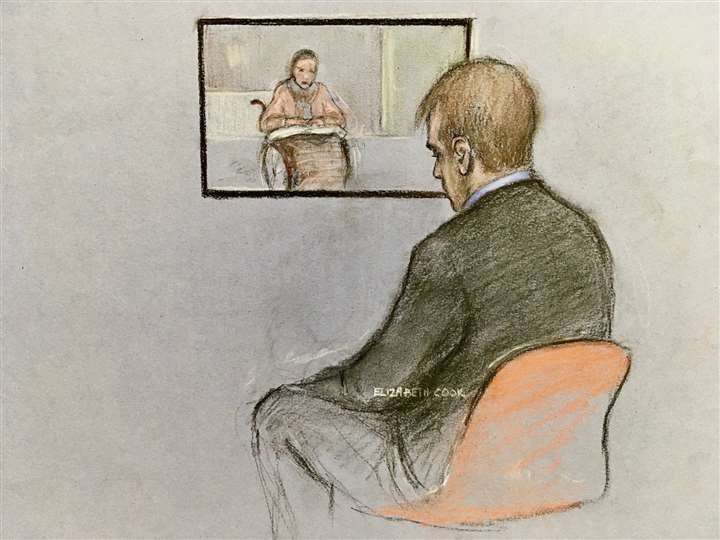 Thomas Schreiber listening to his mother Anne Schreiber, who appeared via video link (Elizabeth Cook/PA)