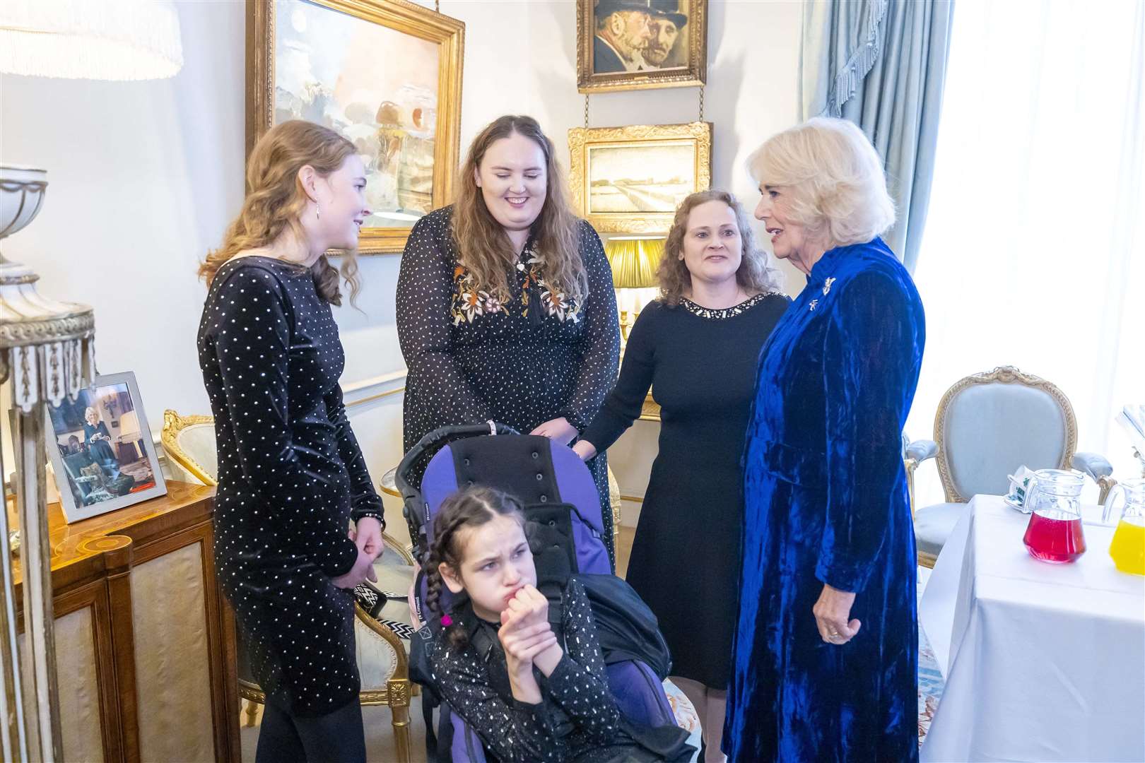 Katie Verney, Sorcha Cantwell, Marie Verney and daughter Faye (front), meet the Queen at Clarence House
