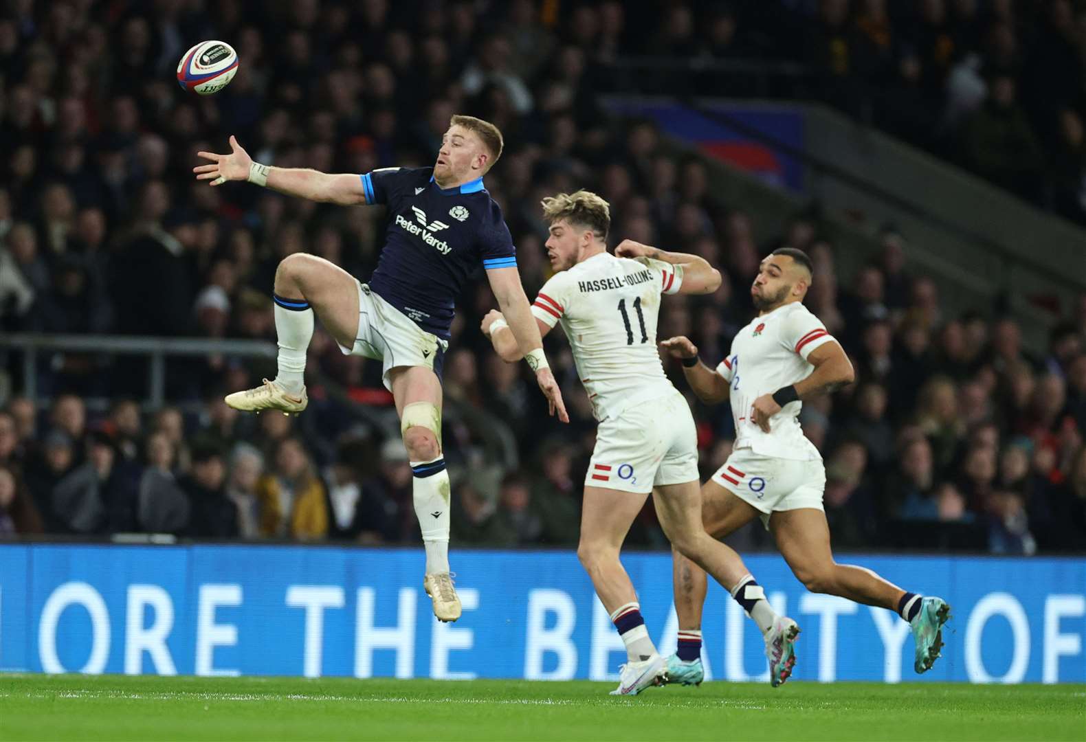 Hassell-Collins competes in the air during his international debut. RFU Collection via Getty Images