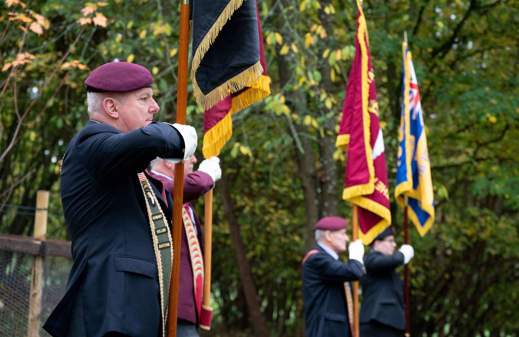 Standard-bearers stand to attention at RAF Welford Remembrance service. Credit: Adam Enbal / USAF