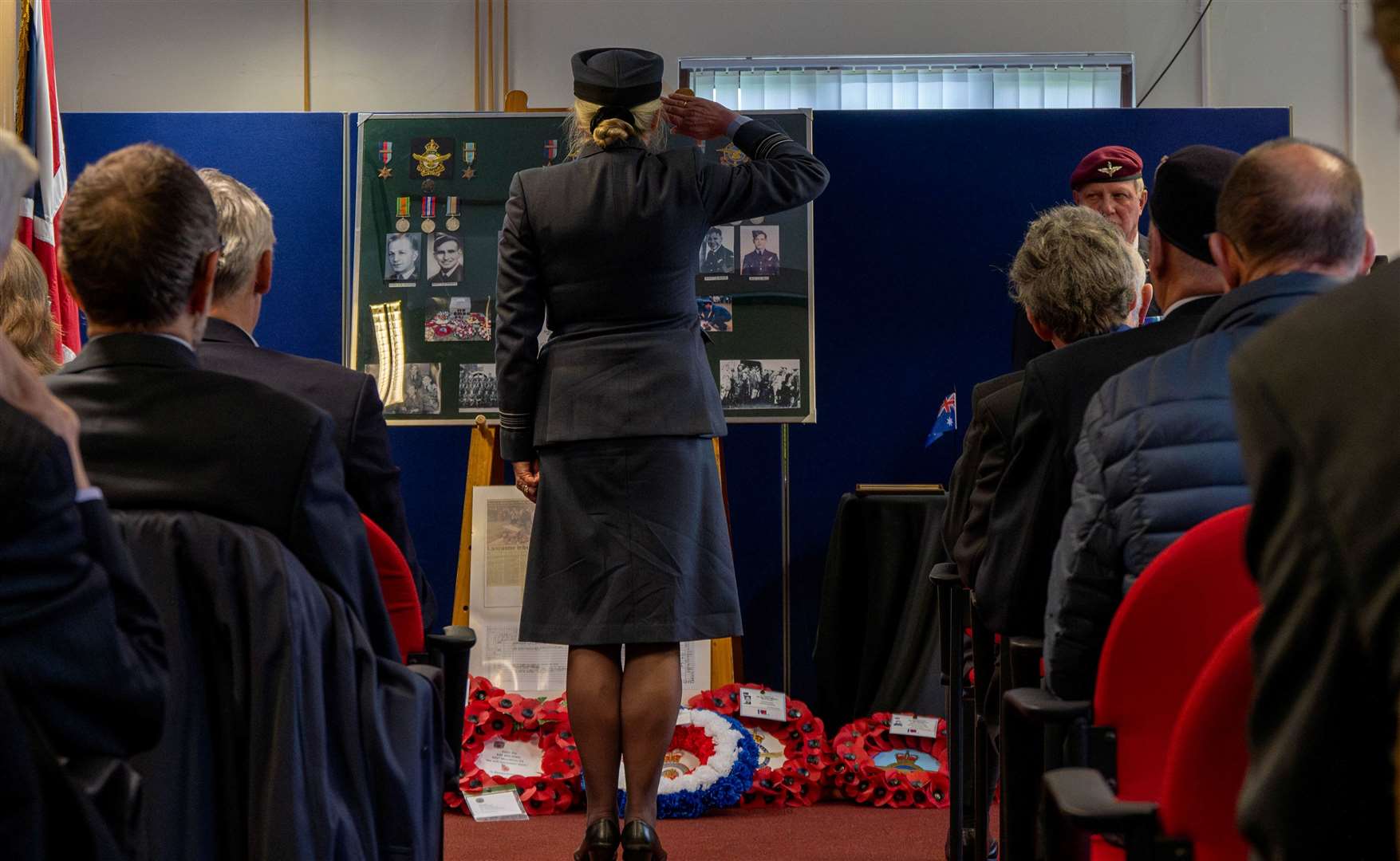 RAF Sqn Ldr Jayne Robertson saluting during the service. Credit: USAF Staff Sgt Jessica Avallone