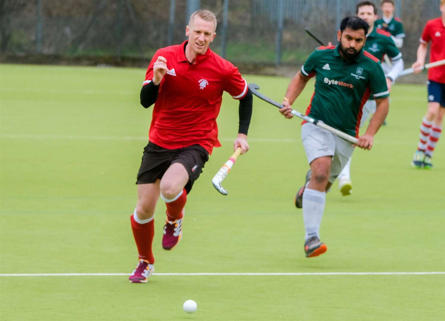 The men's second team in pursuit of possession