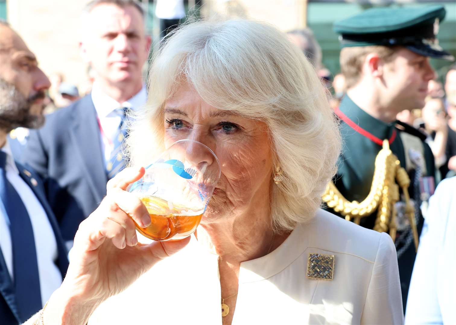 The Queen tastes a drink during a visit to a UK-Emilia Romagna Food Festival at Piazza del Popolo, in the heart of Ravenna (Chris Jackson/PA)