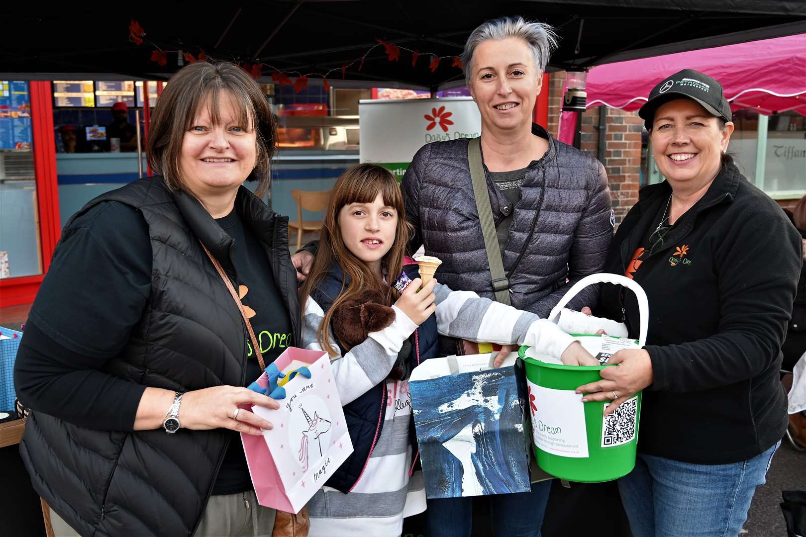 Thatcham Fest.Daisy's Dream stall: Sarah Beckett, Alice (10 & Luminita Dumitru with Joanne Stewart.
