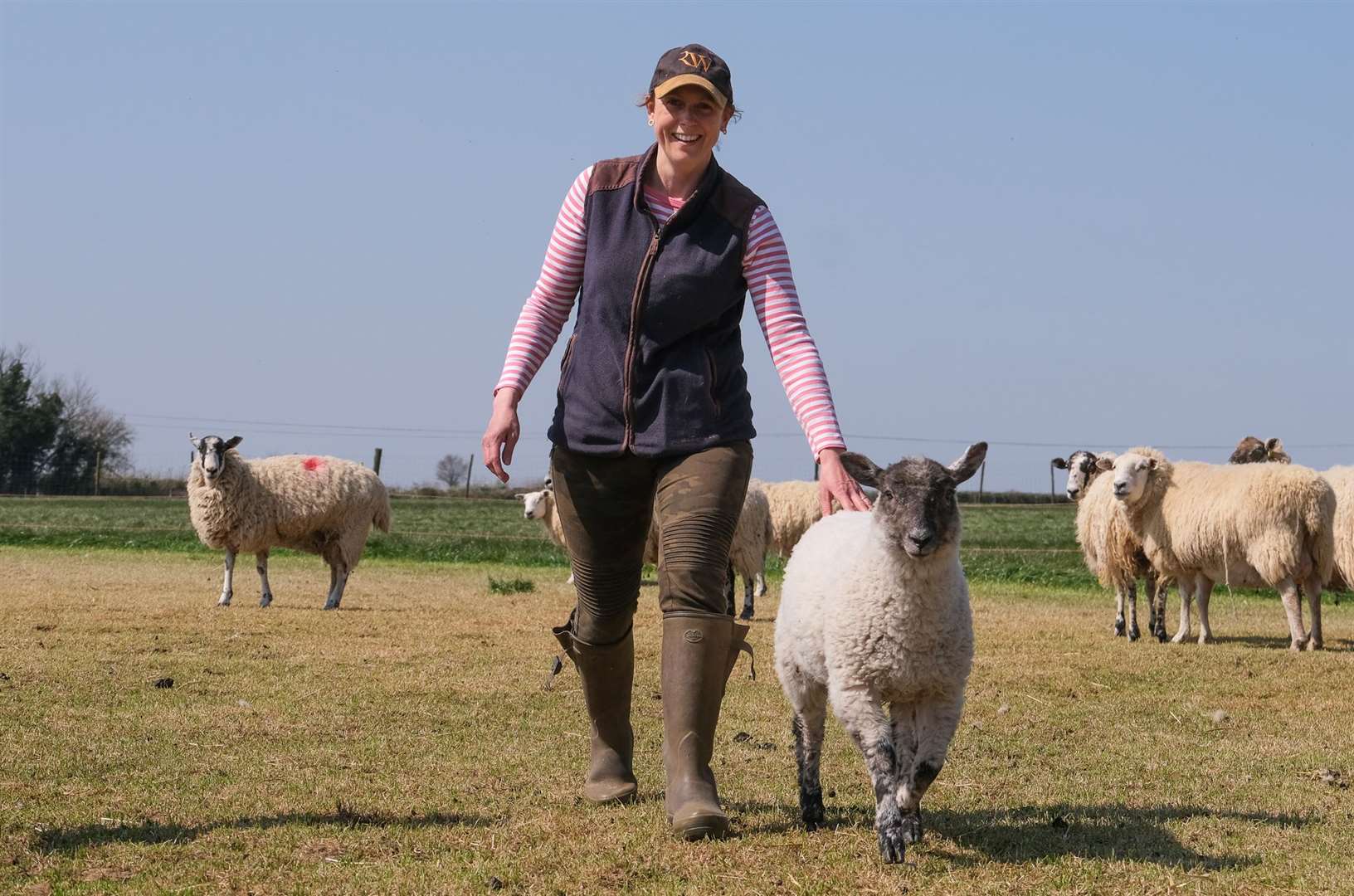 Bower Farm - Aldworth, Clover goes for a walk with Kate Walters to check on the sheep Picture by Phil Cannings (46428878)