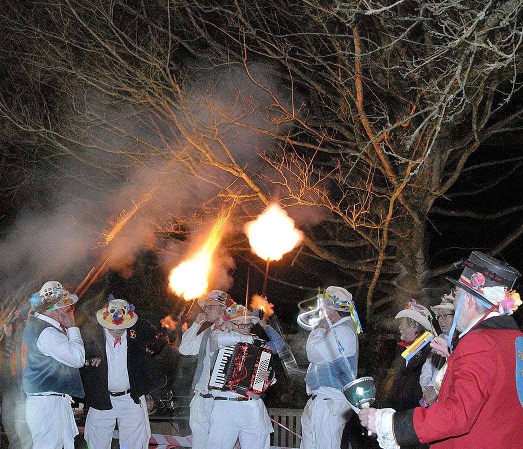 Morris men pause as the muzzleloaders fire their volley Picture Geoff Fletcher