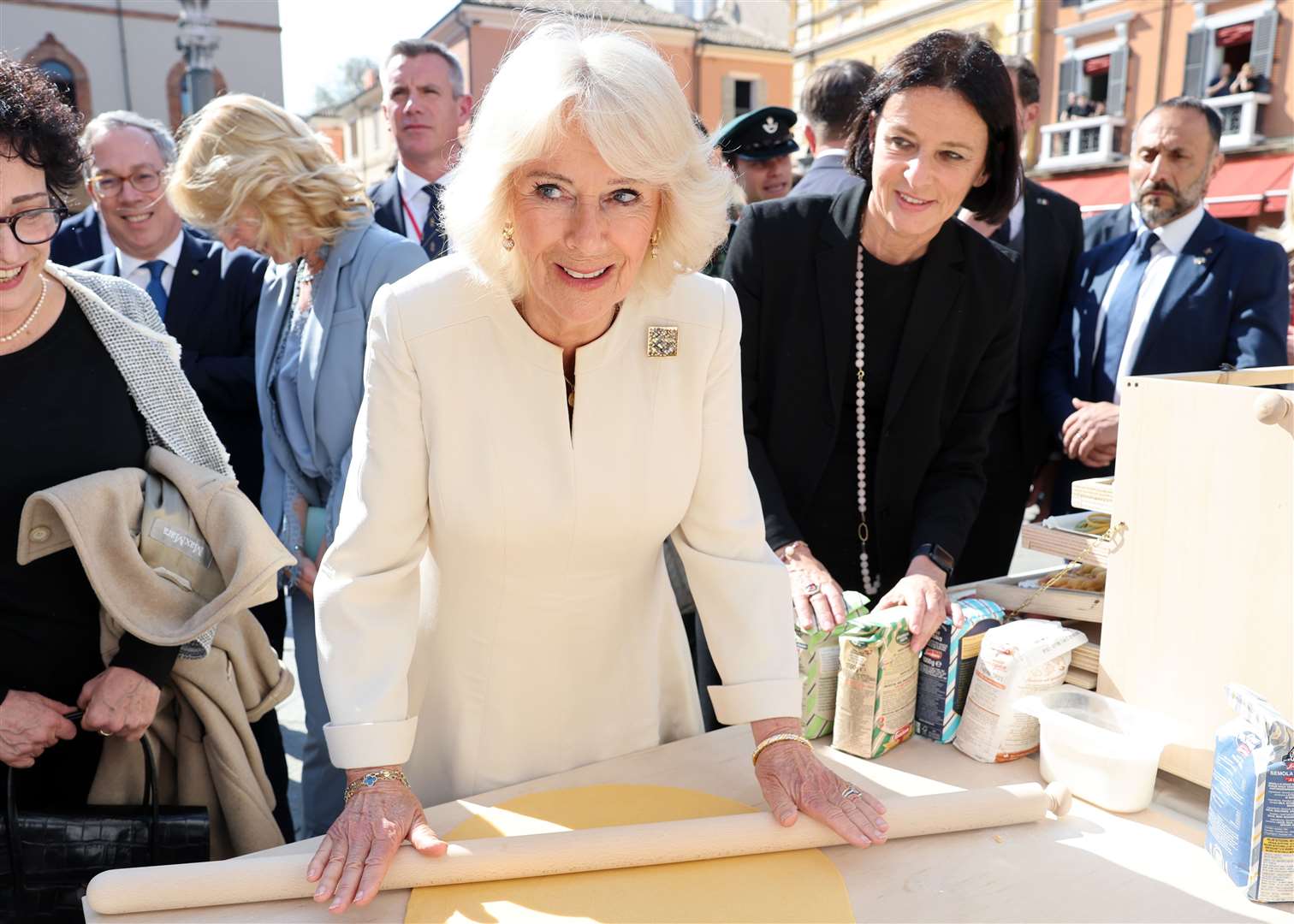 Queen Camilla tries her hand at making pasta during a visit to a UK-Emilia Romagna Food Festival at Piazza del Popolo in the heart of Ravenna (Chris Jackson/PA)