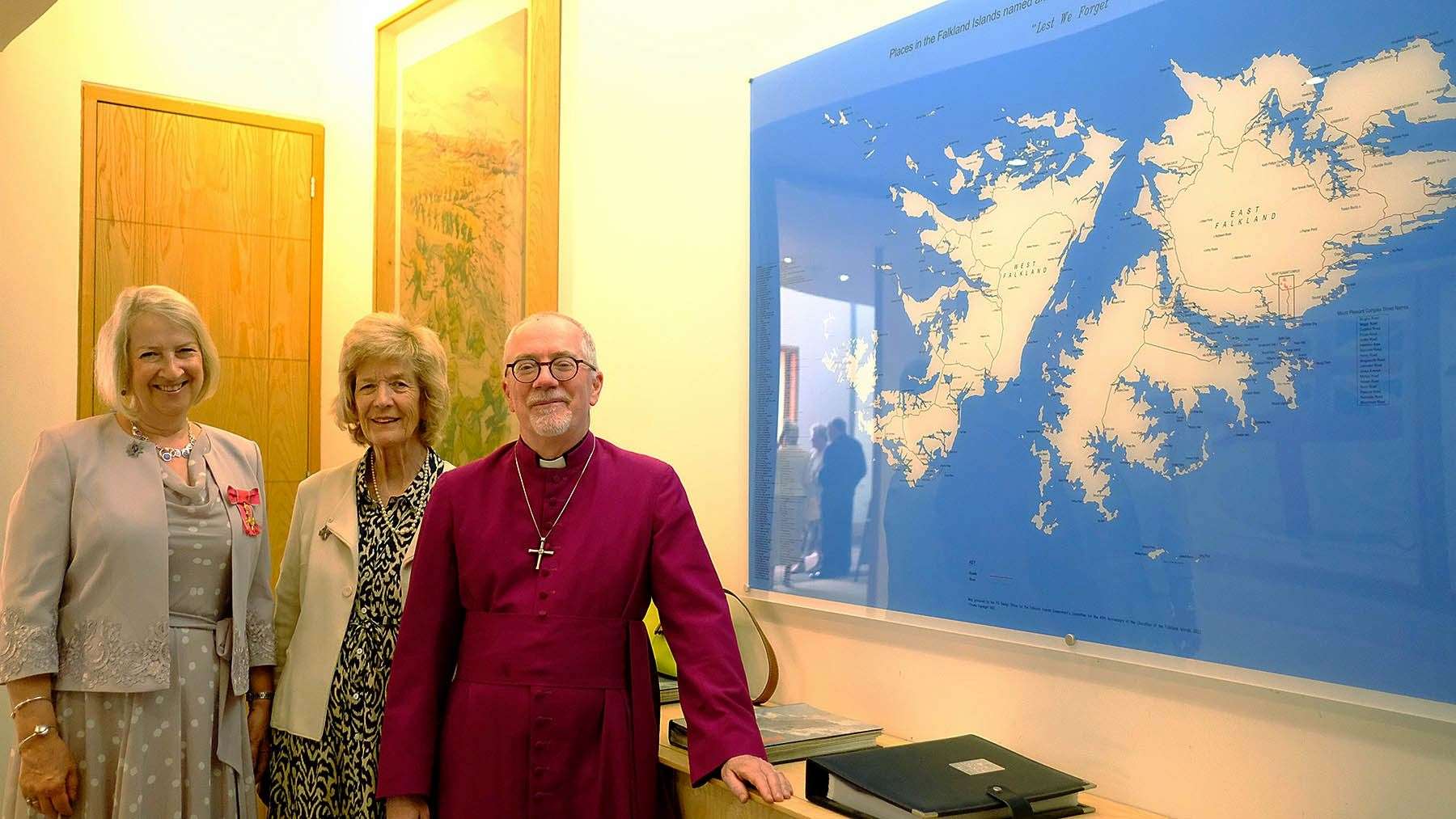 Sukey Cameron, Sara Jones and Rev Jonathan Clark stand by the new Falkland Islands map installation in the Memorial Chapel