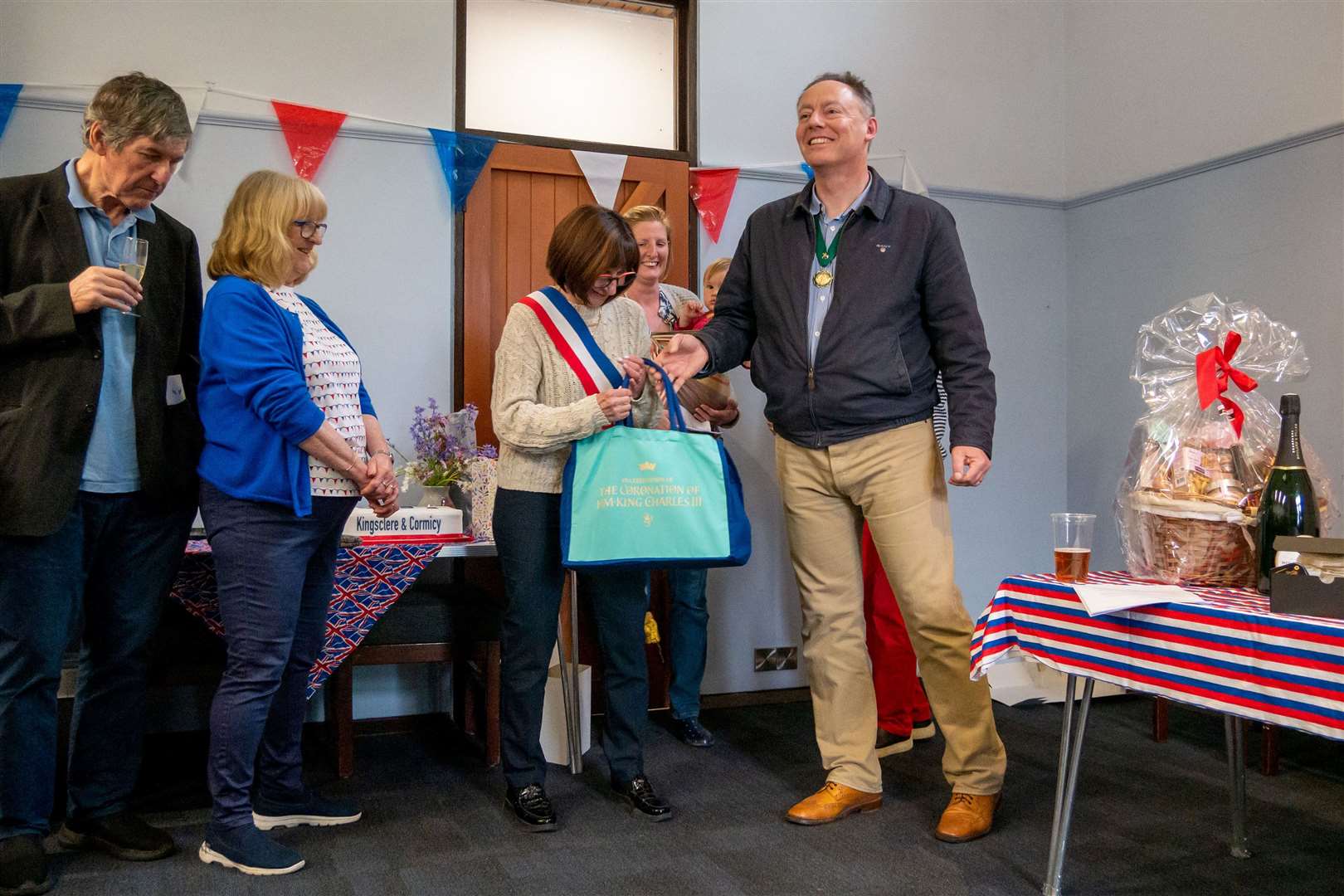 Mr Mussett presenting the French mayor with an array of English goods