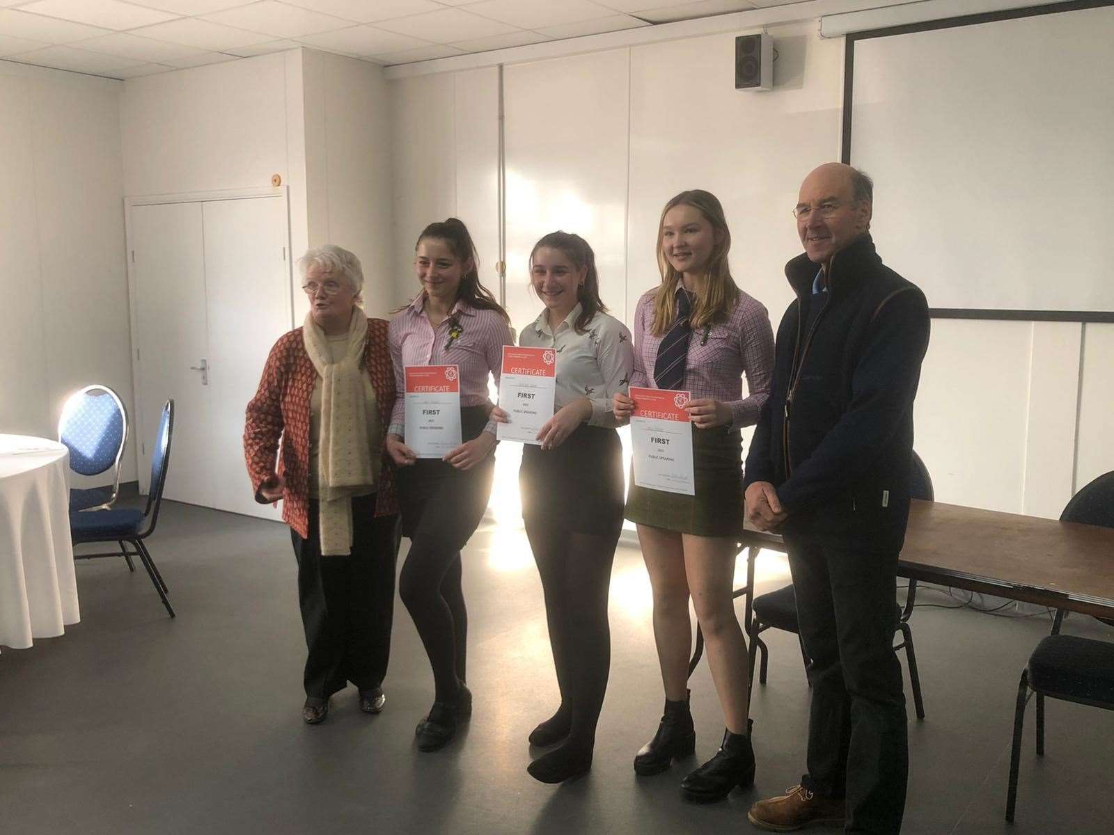 Flanked by a competition judge on each far side, are, left to right: Alice Phillips, Scarlett Slatter and Aine Stanley
