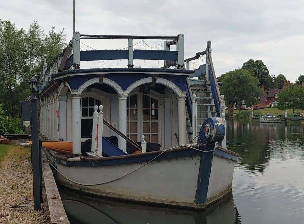 The Magdalen Barge, built in 1927, currently moored on the River Thames in Streatley. Credit: John Gripton