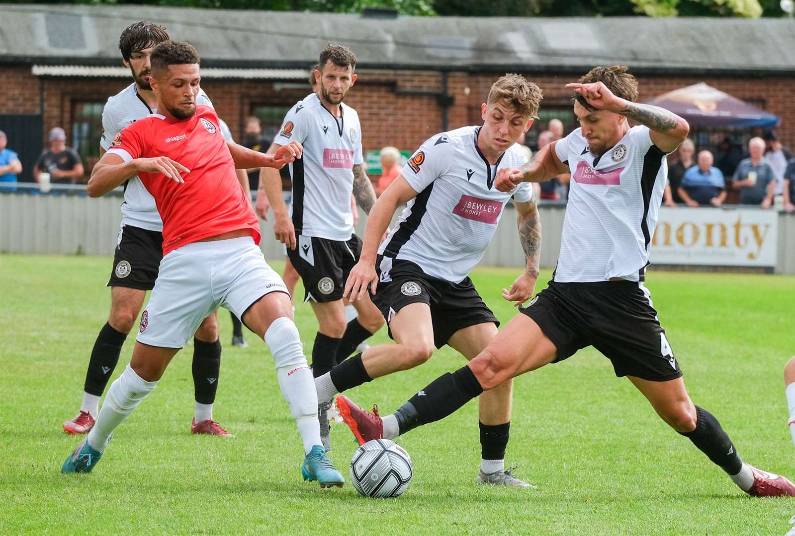 A determined George Smith battles for the ball