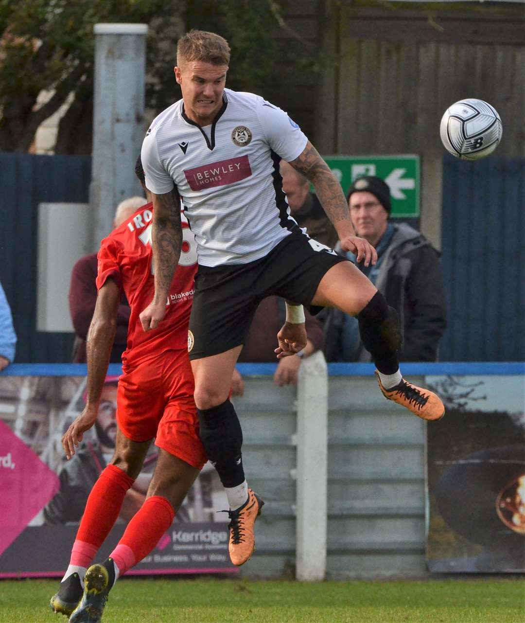 Matt Partridge wins an aerial duel against Bromley