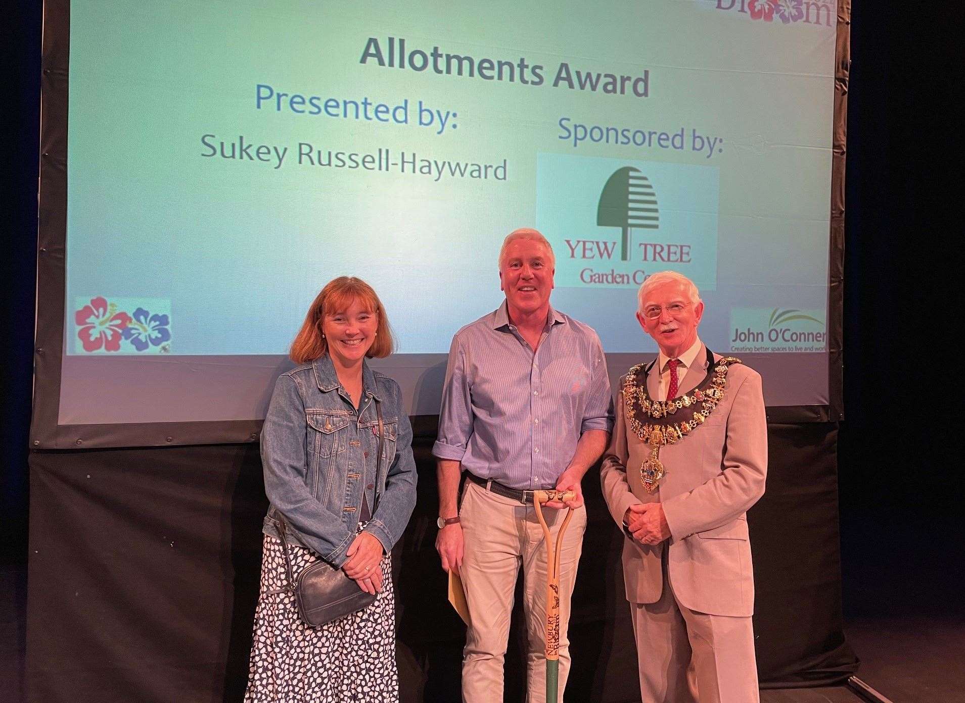 James Berry at West Mills allotments scooped the allotments award, which was presented by Sukey Russell-Hayward (left), watched by the mayor of Nebwury, Andy Moore