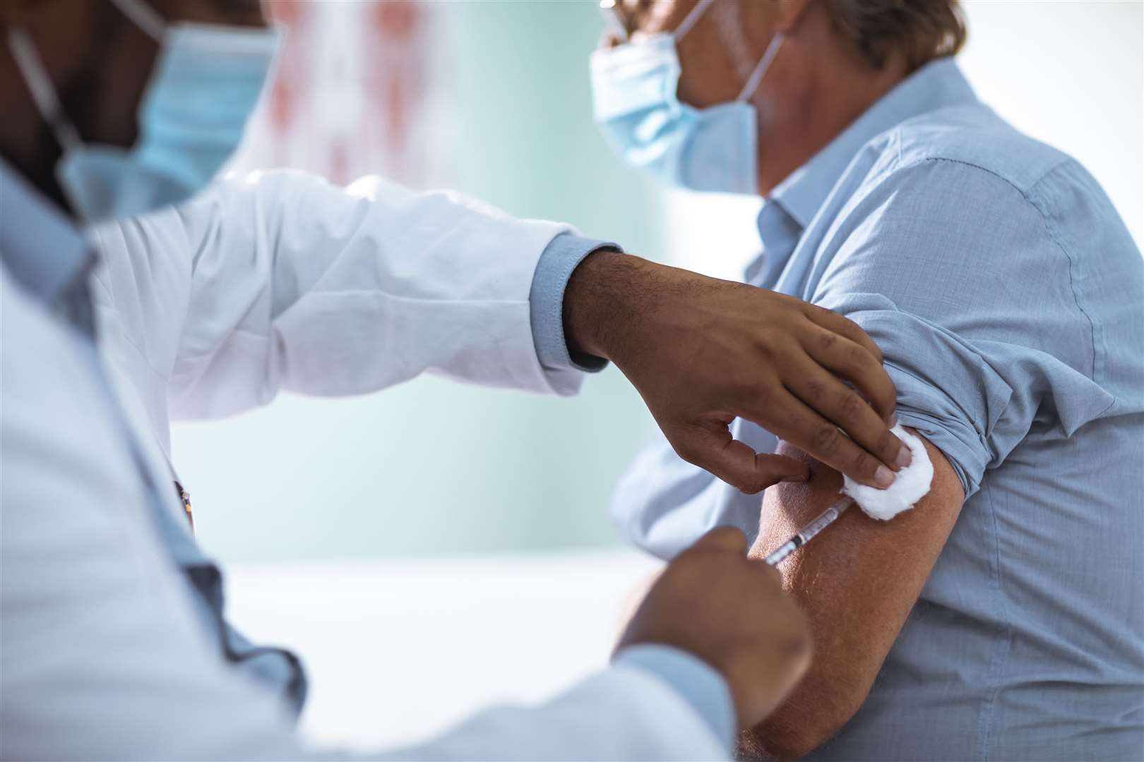 A Covid-19 vaccination is administered