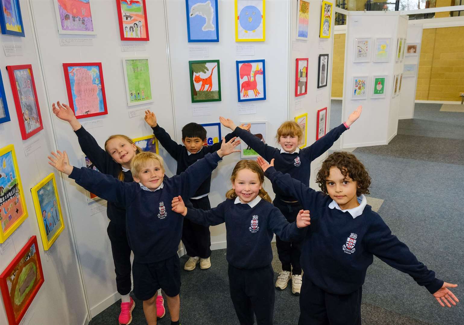 Children in front of their art