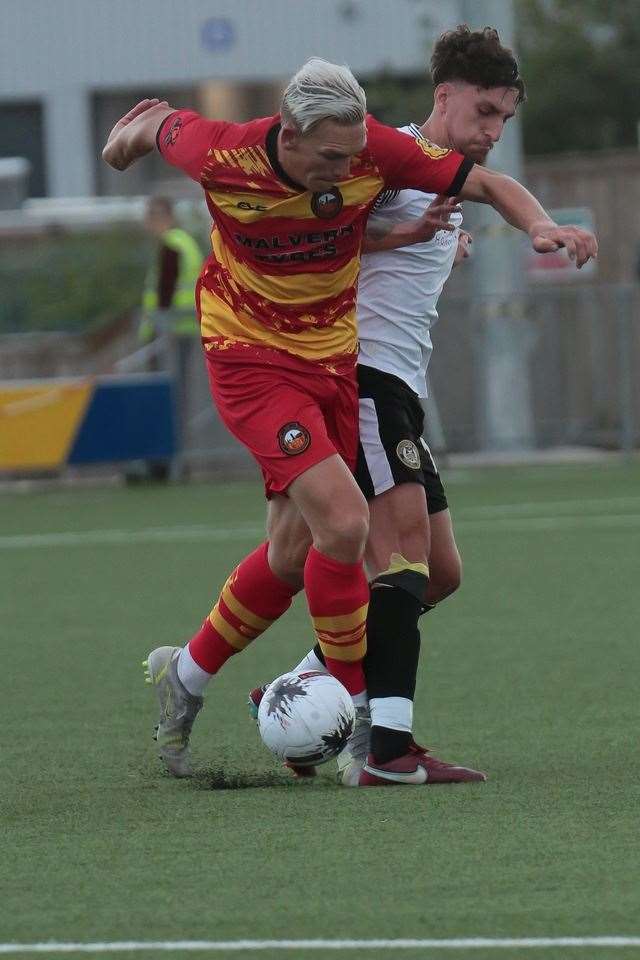 Goalscorer Danny Wright is marshalled by George Smith