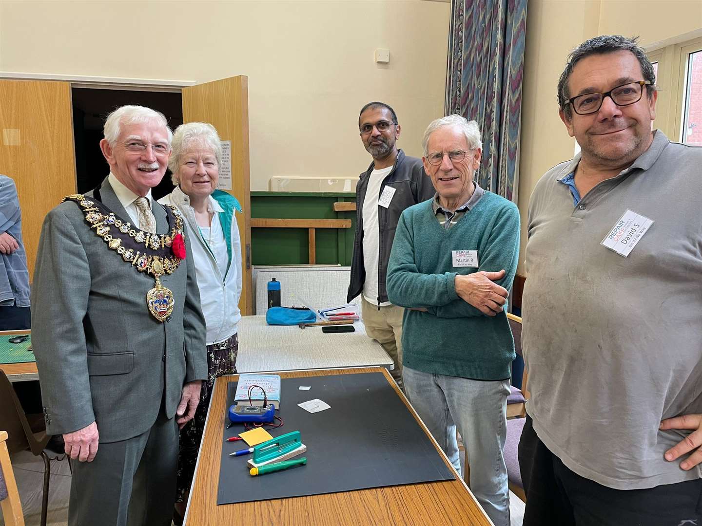 Mr Moore talking to repair café volunteers