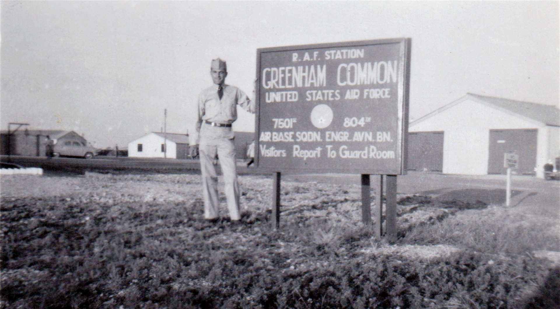 George Tiss standing by the entrance to RAF Greenham Common in June 1952