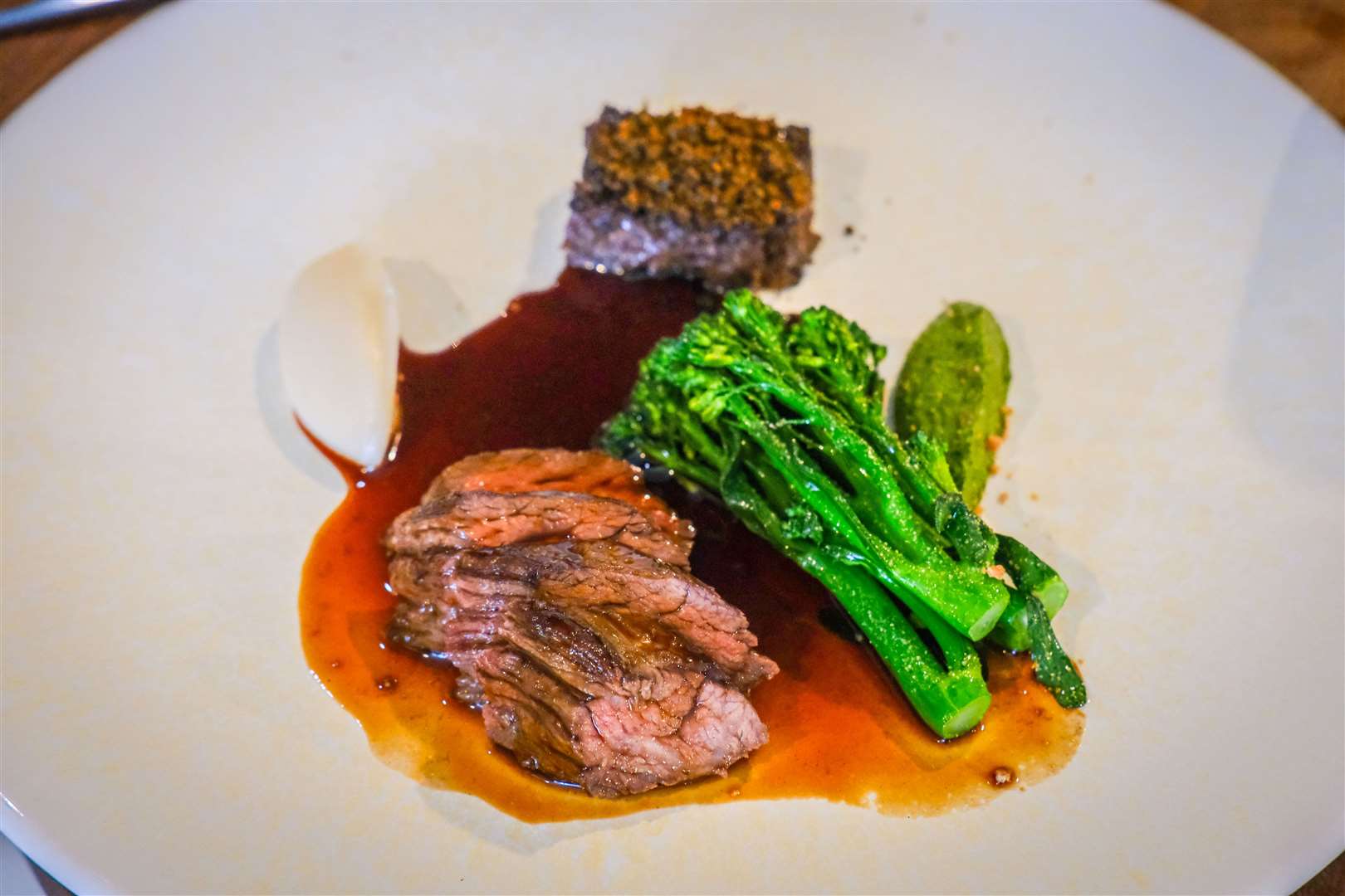 Bavette with Guinness braised cheek, celeriac and yeast, broccoli and green sauce
