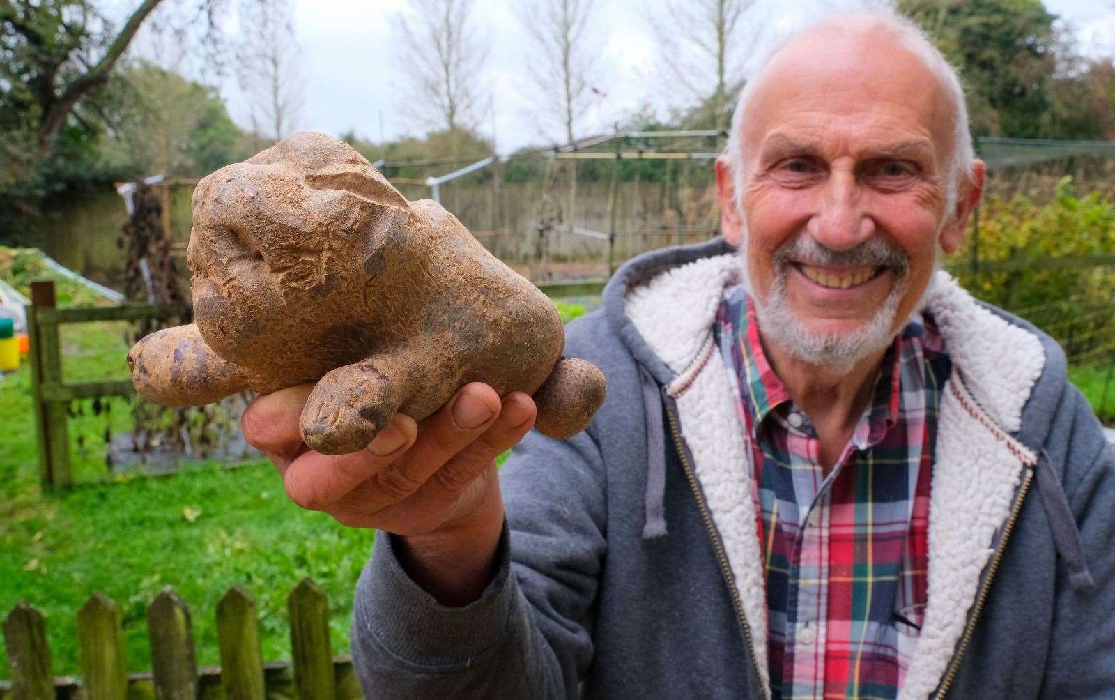 Chris Gittins, former head at Theale Green, with his unusual potato
