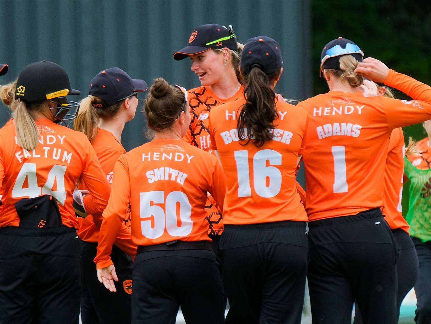 Bell and her Vipers teammates celebrate her wicket