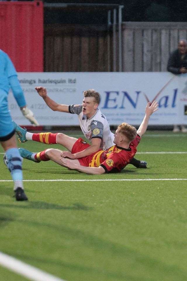 Academy product Toby Thorp is brought down for the penalty