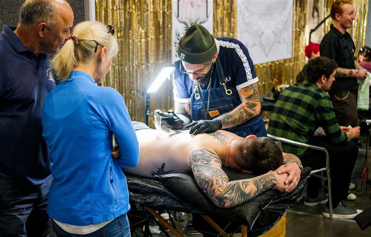 Acclaimed Tattoo Convention Receives High Praise as Artists and Enthusiasts Gather in Newbury 6 Tattoo convention - Tattoo artist Scott Oliver