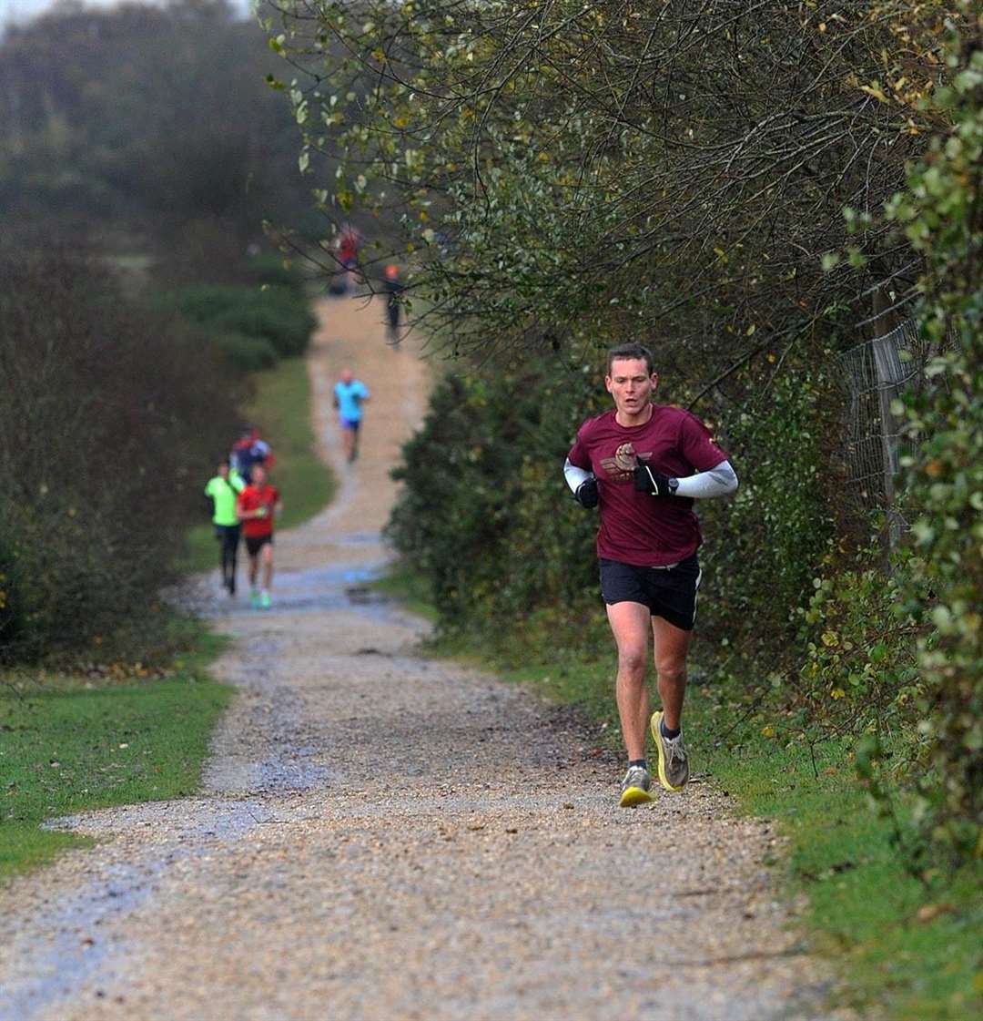 The first runner flies up the hill.