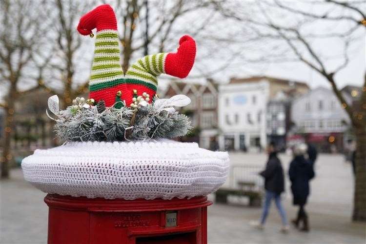 A festive yarn bomb on the top of a Royal Mail post box in Salisbury, Wiltshire. The advice this year is to post early (PA) (61067979)