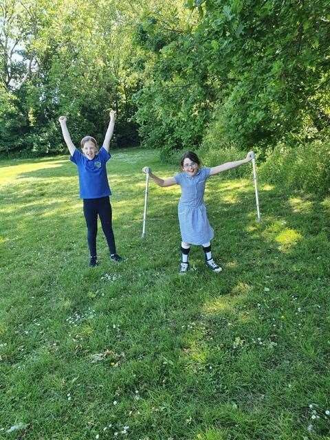 Maeve and Abbie after they had finished the 5k they completed in their garden (57027007)