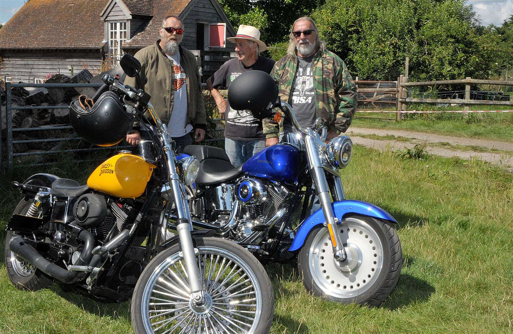 Mark, George and Steve with the Harley Davidsons. Informal meet of classic cars and motorbikes at The Bell at Aldworth, July 28 2024 Pic: Geoff Fletcher