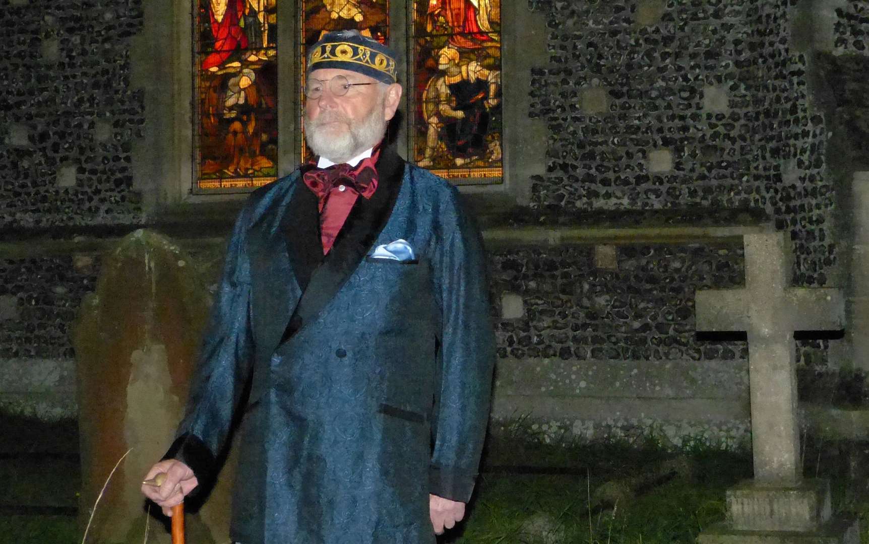 Mike Huxtable playing the role of a person buried in the cemetery in 2015